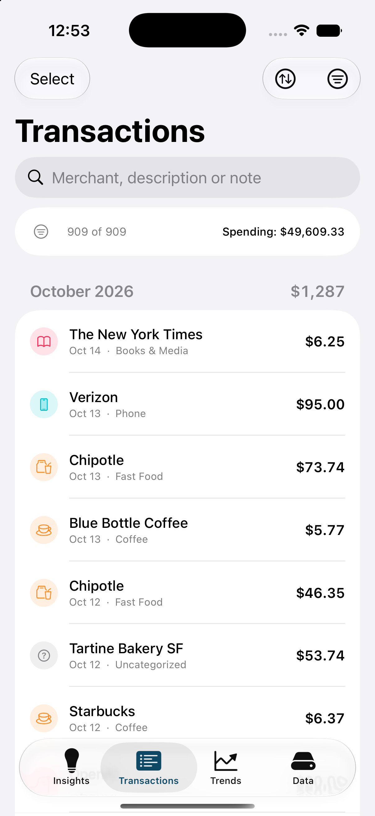 The transaction ledger grouped by month with category icons and amounts.